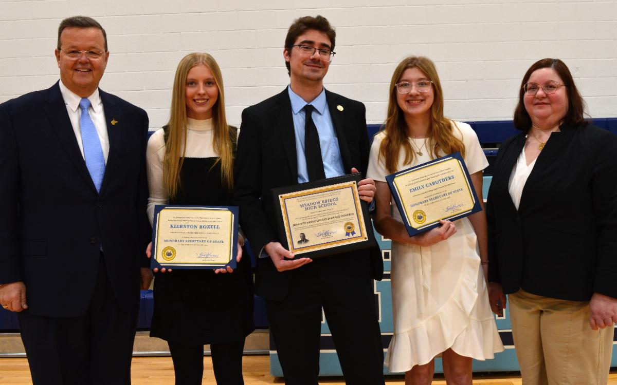 Kris Warner recognizing Emily Carothers and Kierston Rozell as Honorary Secretaries of State