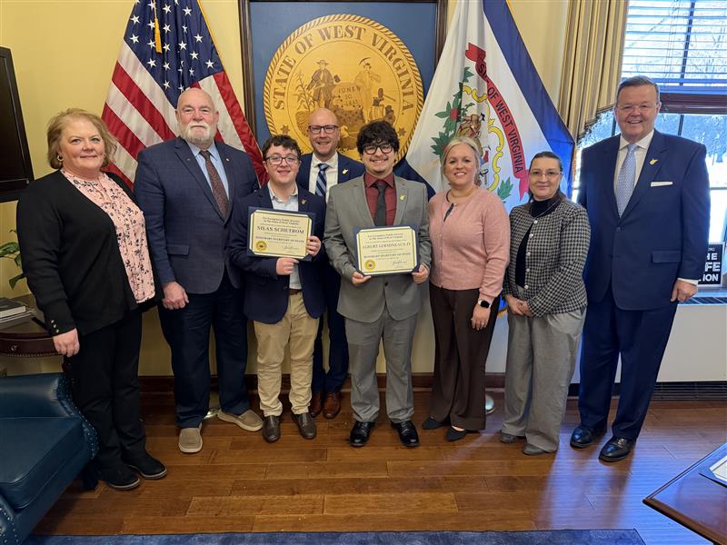 EHHS Assistant Principal Jessica Baker, Delegate Bryan Wood, HSOS student Silas Schetrom, Hardy County Commissioner Steven Schetrom II, HSOS student Albert Lermineaux IX, Albert's mother Sondra Murphy, Hardy County Clerk Loretta Humbertson, and WV Secretary of State Kris Warner