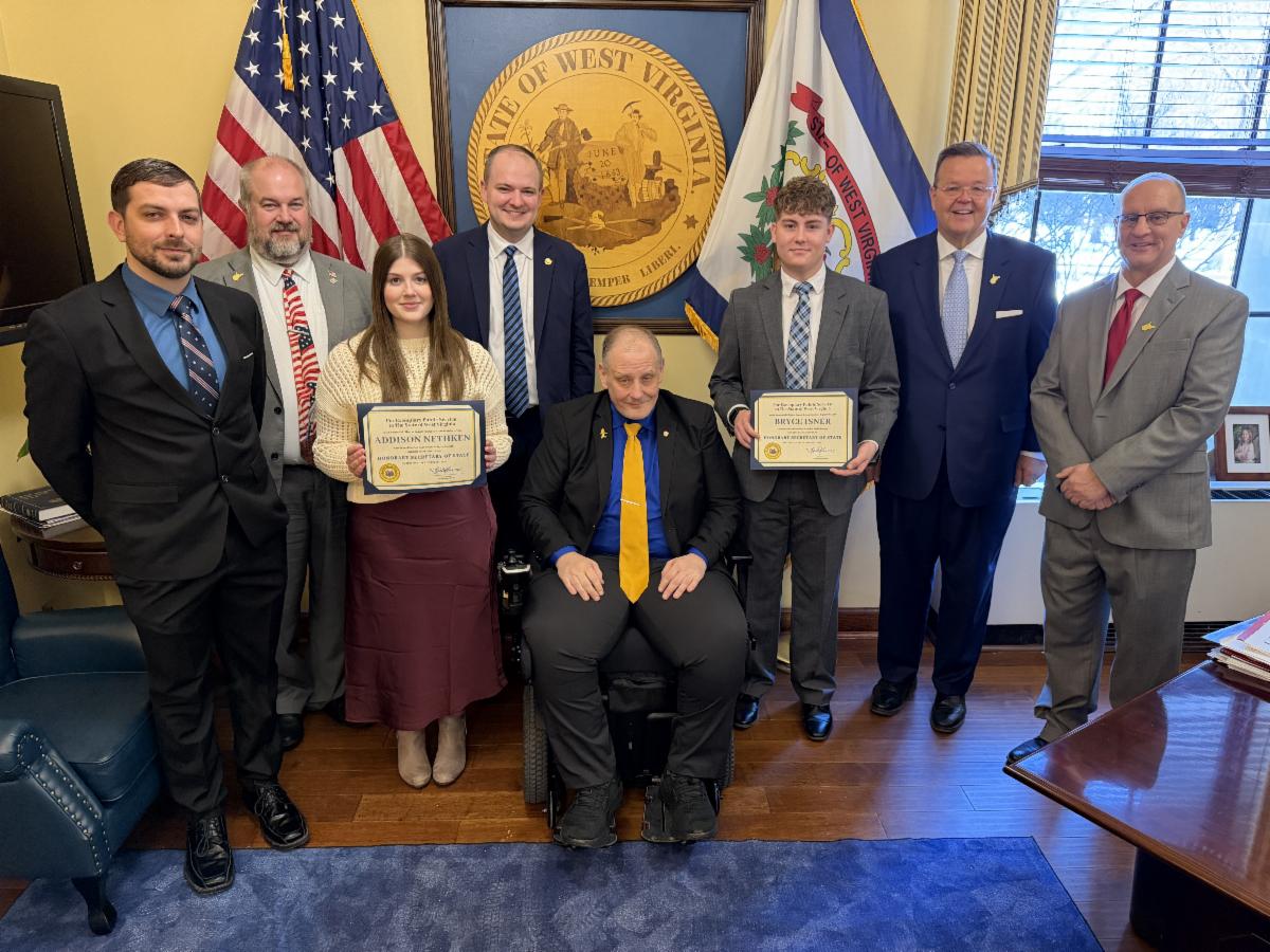 Taylor County Clerk Jaron Freeman, State Senator Jay Taylor, HSOS Student Addison Nethken, State Senator Ben Queen, Delegate Bryan Smith, HSOS Student Bryce Isner, WV Secretary of State Kris Warner, and Taylor County Deputy Clerk Rob Gallo.