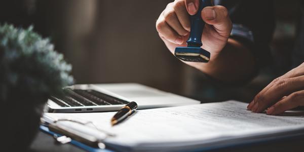 Document being stamped by a notary